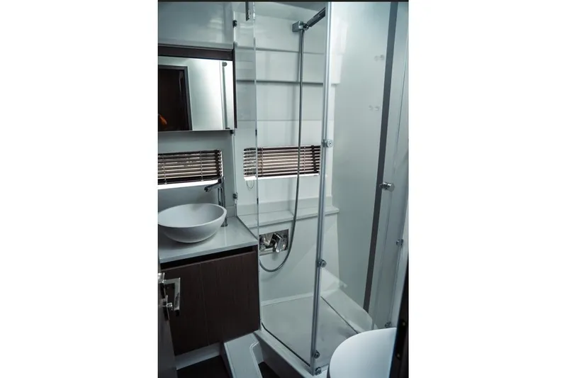 Slide: The Image of Modern bathroom interior of 2025 Jeanneau NC 1295 Coupe yacht with glass shower enclosure. - 38