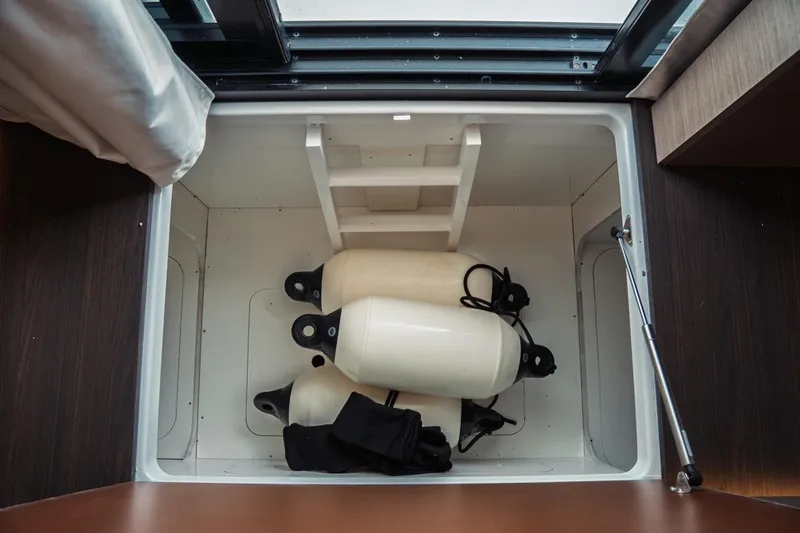 Slide: The Image of Storage compartment with fenders in 2025 Jeanneau NC 1295 Coupe boat. - 12