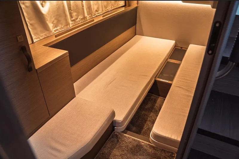 Slide: The Image of Interior of 2025 Jeanneau NC 1295 Coupe, featuring cozy seating and modern design. - 44