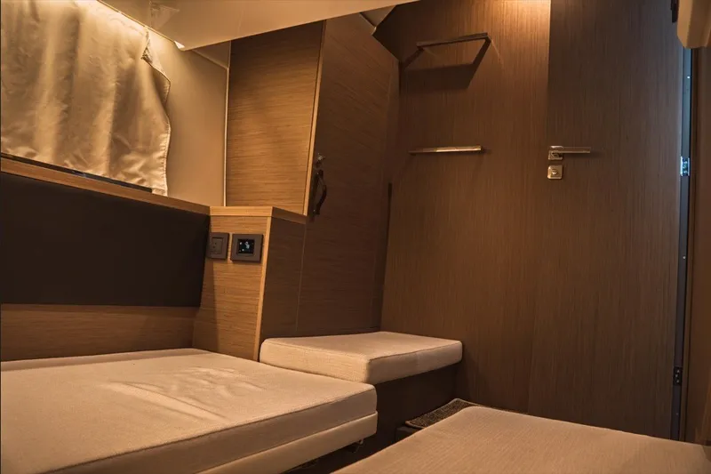 Slide: The Image of Interior cabin of 2025 Jeanneau NC 1295 Coupe, featuring modern wood finish and seating. - 35