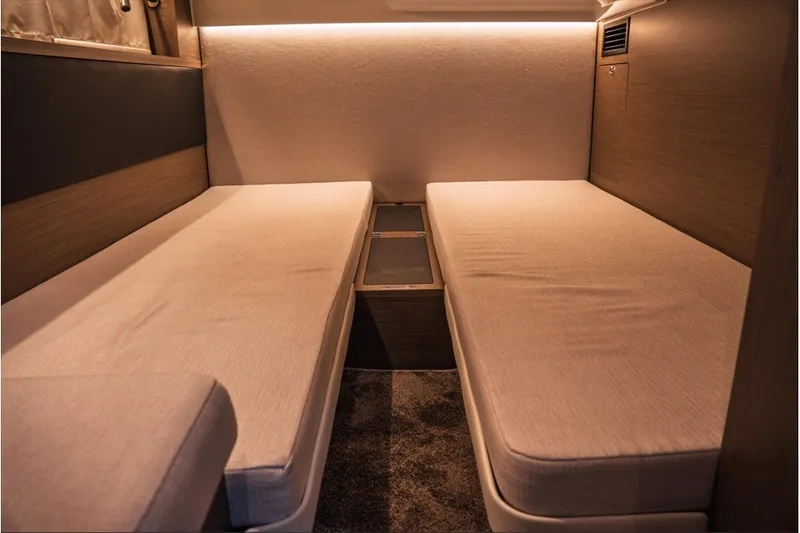 Slide: The Image of Interior cabin of 2025 Jeanneau NC 1295 Coupe with twin beds and modern design. - 43