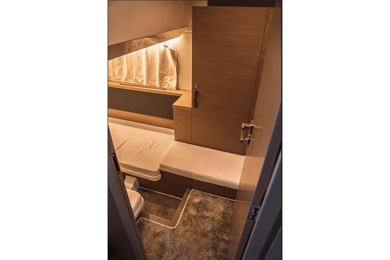 Slide: The Image of Interior cabin of 2025 Jeanneau NC 1295 Coupe, featuring modern design and cozy seating. - 41