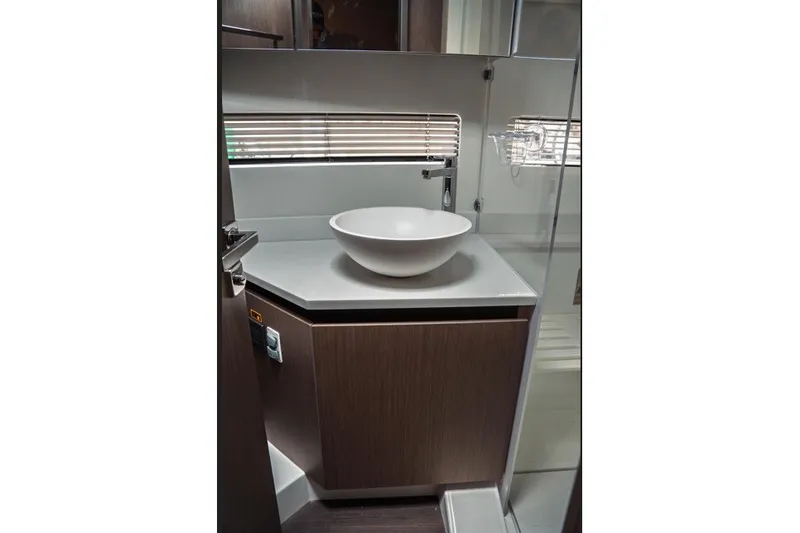Slide: The Image of Modern bathroom interior of 2025 Jeanneau NC 1295 Coupe yacht with sleek basin design. - 31