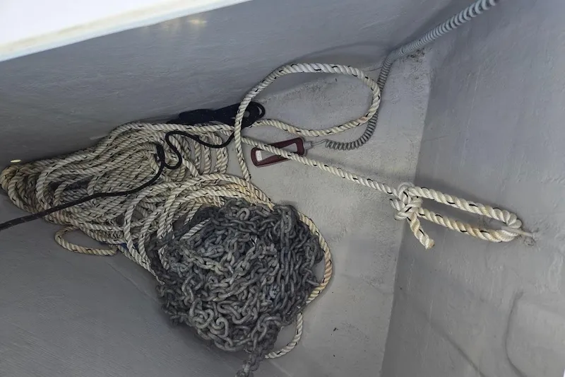 Slide: The Image of Ropes and chains in the anchor locker of a 2023 Beneteau Oceanis 38.1 sailboat. - 74
