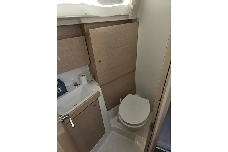 Slide: The Image of 2023 Beneteau Oceanis 38.1 yacht bathroom with modern fixtures and compact design. - 57