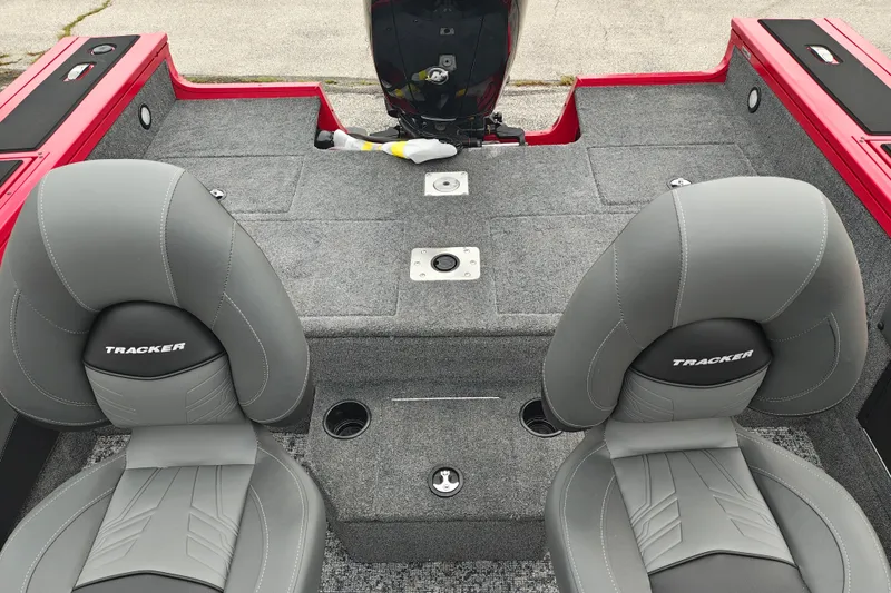 Slide: The Image of 2026 Tracker Targa V-19 WT boat interior with gray seats and carpeted deck. - 18