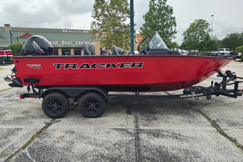 The Image of 2026 Tracker Targa V-19 WT boat in vibrant red on a trailer at a boat center. - 0