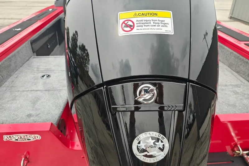 Slide: The Image of 2026 Tracker Targa V-19 WT boat engine with caution label and ultra-low emission badge. - 23