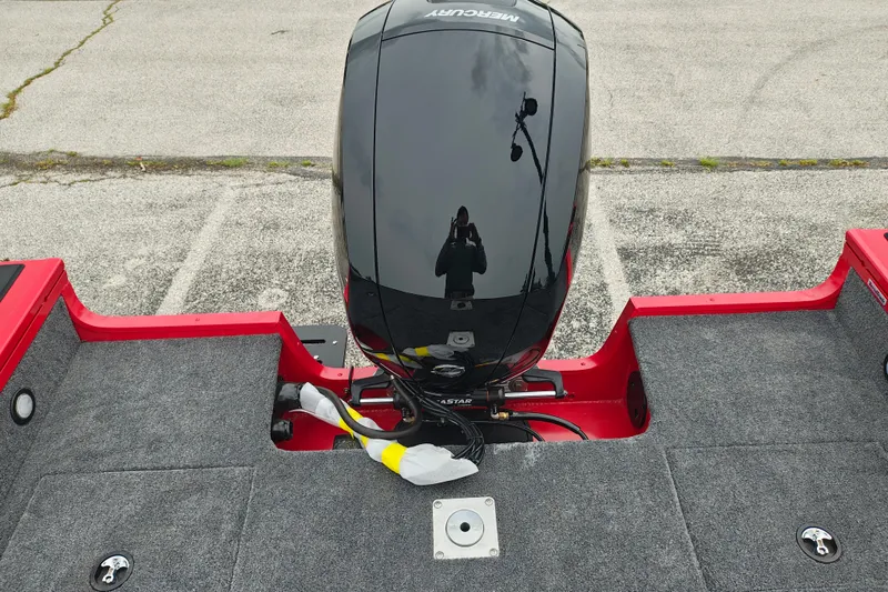 Slide: The Image of 2026 Tracker Targa V-19 WT boat with Mercury engine, red and gray deck. - 19