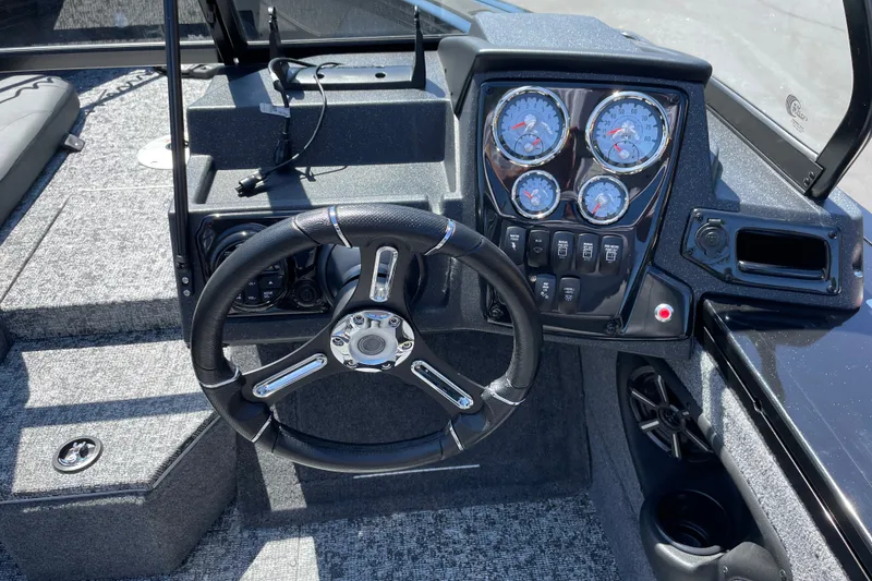 Slide: The Image of Steering console of 2026 Tracker Targa V-19 Combo boat with gauges and controls. - 13