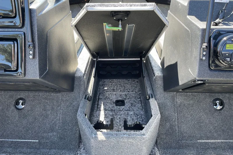 Slide: The Image of Open storage compartment in 2026 Tracker Targa V-19 Combo boat interior. - 16