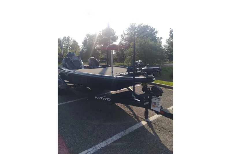 Slide: The Image of 2026 Nitro Z20 XL Pro boat parked outdoors in sunlight. - 7