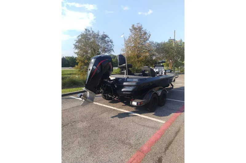 Slide: The Image of 2026 Nitro Z20 XL Pro boat parked outdoors on a sunny day. - 1