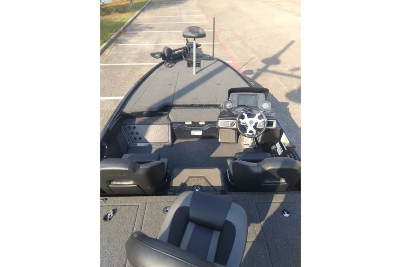 Slide: The Image of 2026 Nitro Z20 XL Pro boat interior with steering wheel and seating. - 8