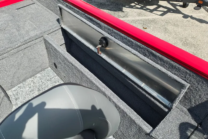 Slide: The Image of Interior of 2026 Tracker Pro Guide V-175 WT boat with gray seating and storage compartment. - 33