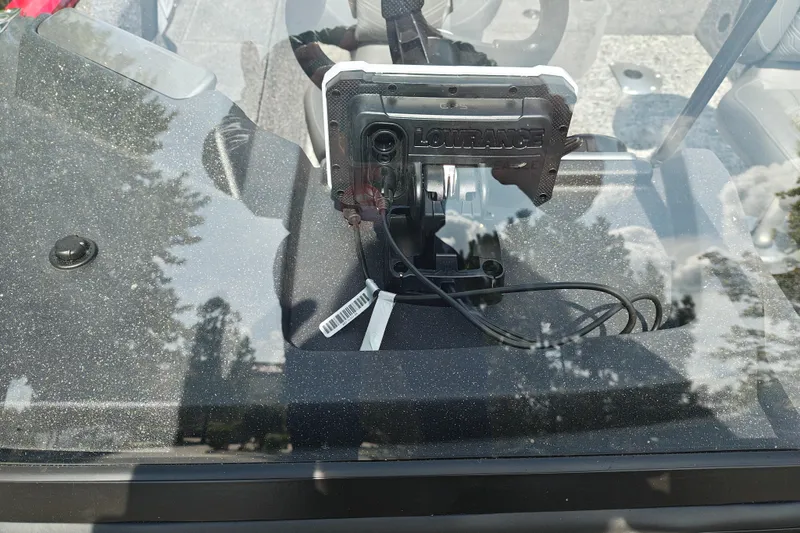 Slide: The Image of Lowrance device on 2026 Tracker Pro Guide V-175 WT dashboard, viewed through windshield. - 30