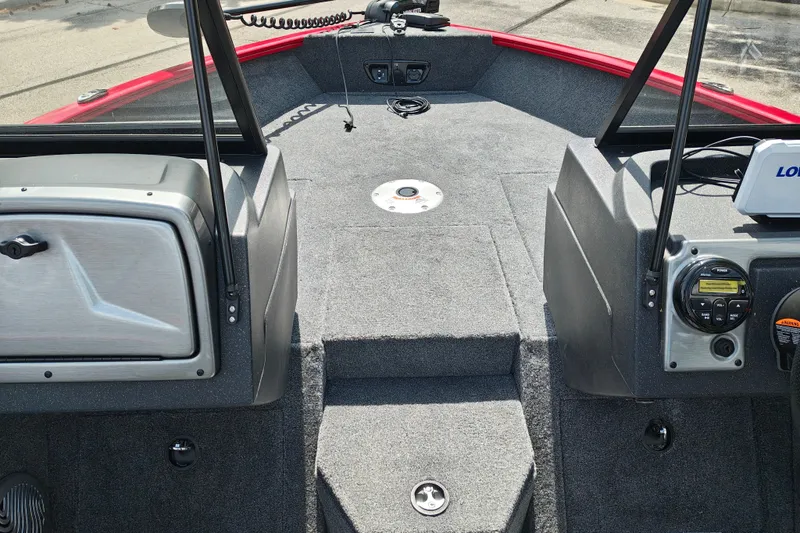 Slide: The Image of Interior of 2026 Tracker Pro Guide V-175 WT boat with carpeted deck and control panel. - 20