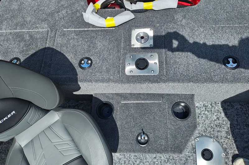 Slide: The Image of 2026 Tracker Pro Guide V-175 WT boat interior with gray seating and deck features. - 34