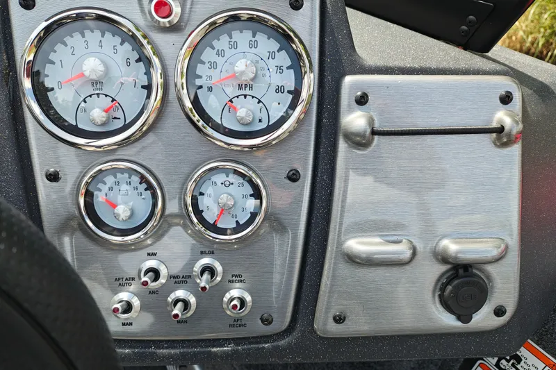 Slide: The Image of Dashboard of 2026 Tracker Pro Guide V-175 WT with gauges and controls. - 38