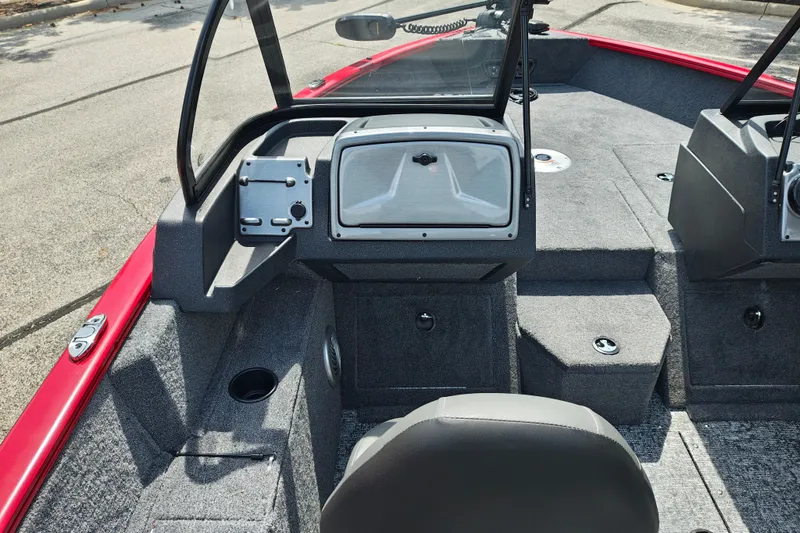 Slide: The Image of 2026 Tracker Pro Guide V-175 WT boat interior with gray carpet and red accents. - 18
