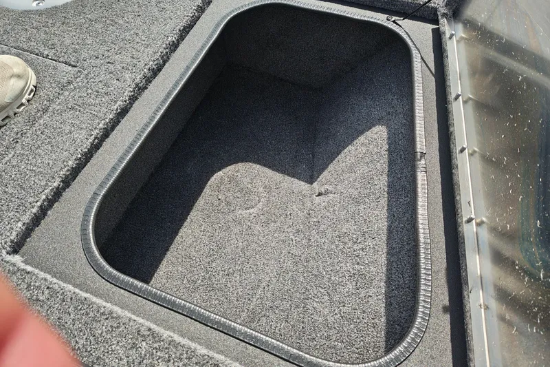 Slide: The Image of Carpeted storage compartment in 2026 Tracker Pro Guide V-175 WT boat. - 26