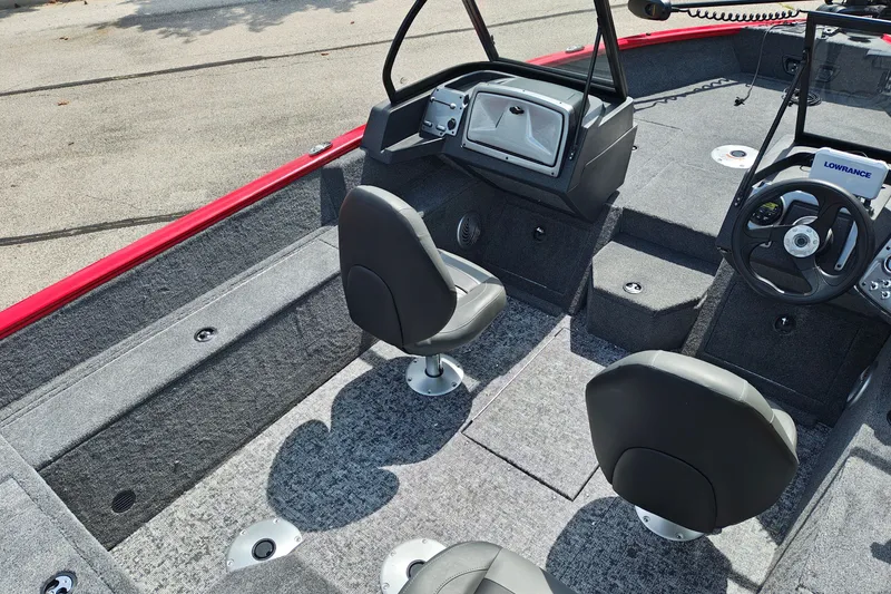 Slide: The Image of 2026 Tracker Pro Guide V-175 WT boat interior with seating and steering console. - 17