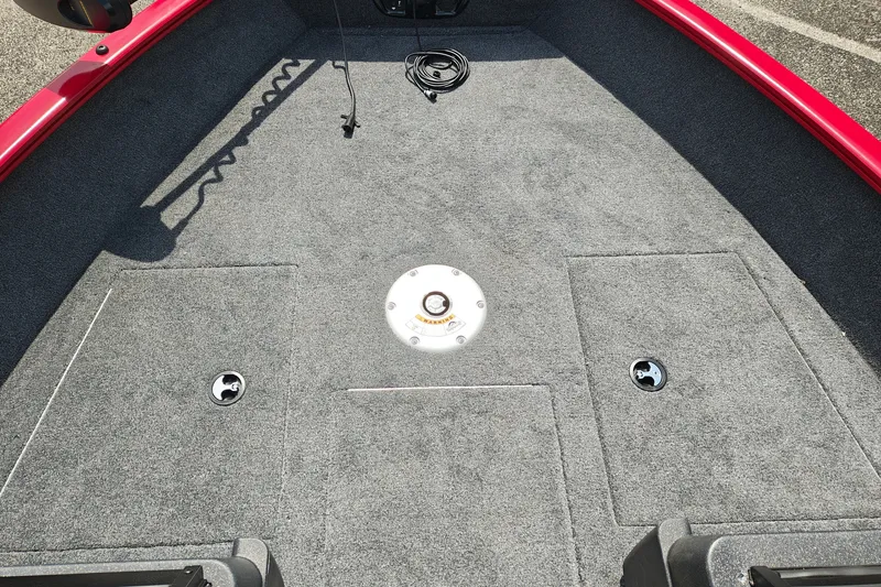 Slide: The Image of 2026 Tracker Pro Guide V-175 WT boat deck with gray carpet and storage compartments. - 23