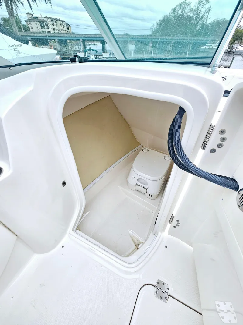 Slide: The Image of 2012 Monterey 244 FS boat interior with compact toilet compartment. - 16