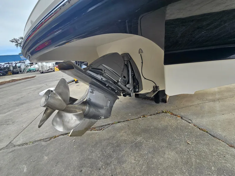 Slide: The Image of 2012 Monterey 244 FS boat propeller and stern view on concrete surface. - 23