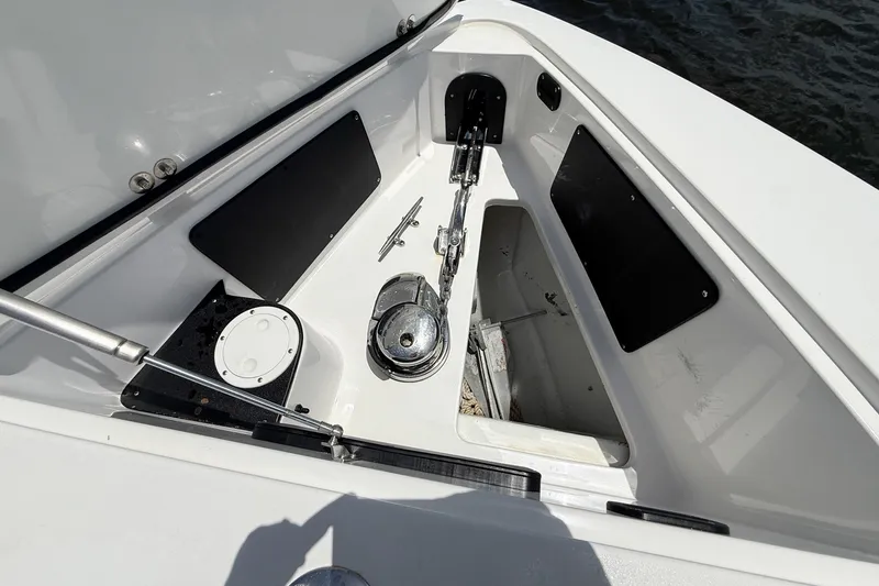 Slide: The Image of Anchor compartment of 2018 Nor-Tech 392 Super Fish boat, featuring storage and hardware. - 16