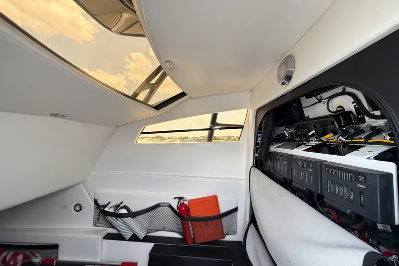 Slide: The Image of Interior of 2018 Nor-Tech 392 Super Fish boat with storage and control panels. - 34
