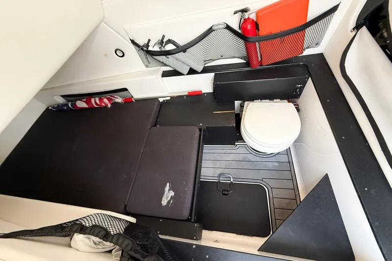 Slide: The Image of Interior cabin of 2018 Nor-Tech 392 Super Fish with seating and marine toilet. - 33