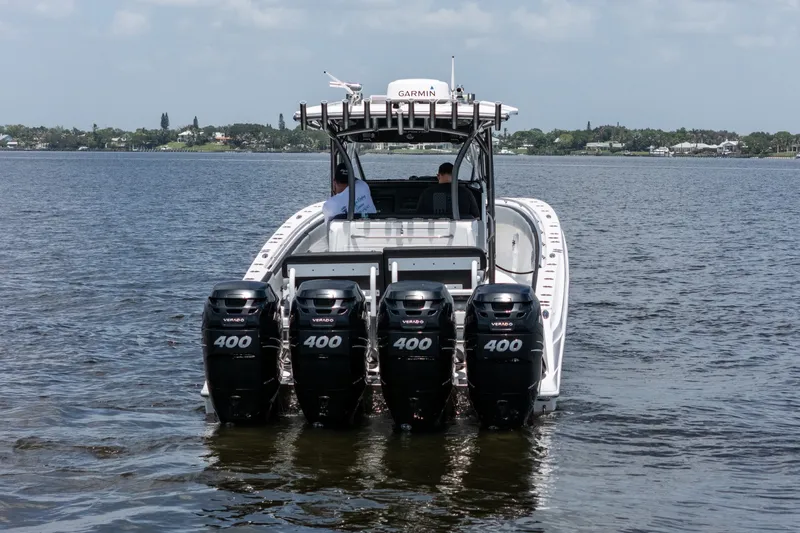 Slide: The Image of 2018 Nor-Tech 392 Super Fish boat with four powerful outboard engines on the water. - 47