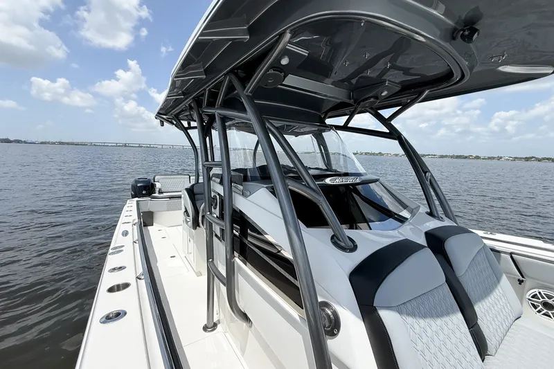 Slide: The Image of 2018 Nor-Tech 392 Super Fish boat on calm water, showcasing sleek design and spacious deck. - 18