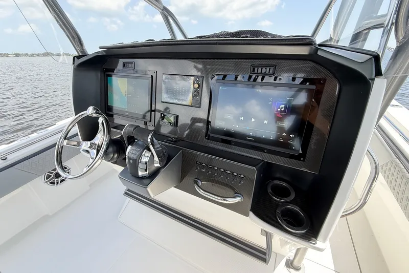 Slide: The Image of 2018 Nor-Tech 392 Super Fish dashboard with advanced navigation and control systems. - 9
