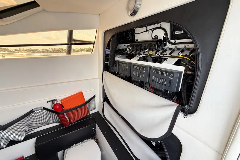 Slide: The Image of Interior view of 2018 Nor-Tech 392 Super Fish boat showing electrical panel and storage. - 31