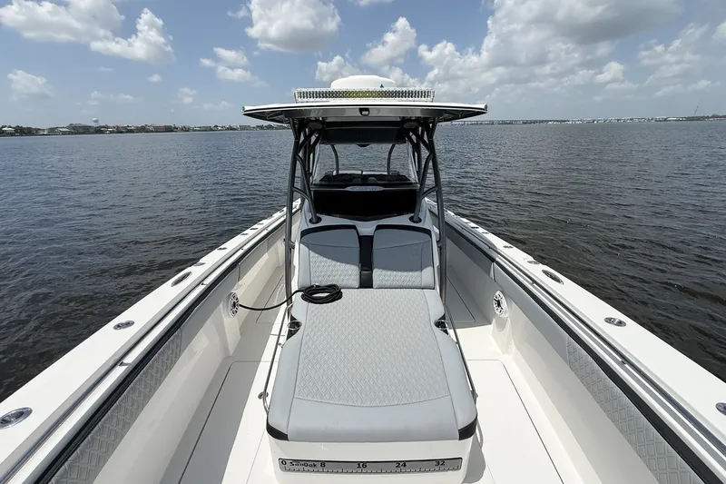 Slide: The Image of 2018 Nor-Tech 392 Super Fish boat on calm water under a partly cloudy sky. - 13