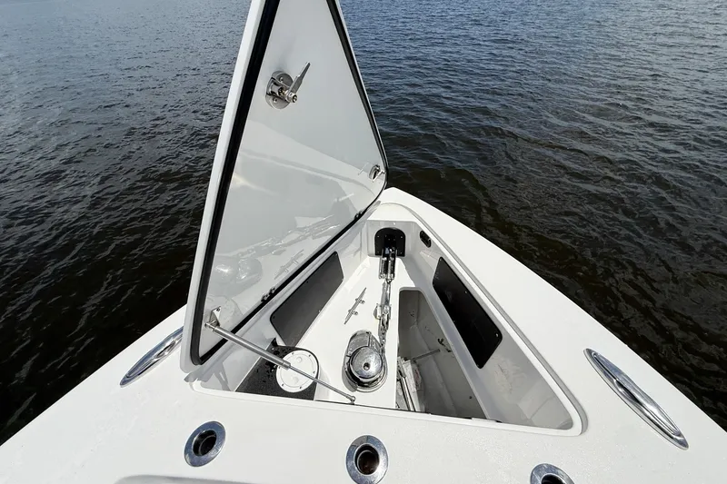 Slide: The Image of Open anchor compartment on 2018 Nor-Tech 392 Super Fish boat, floating on water. - 15