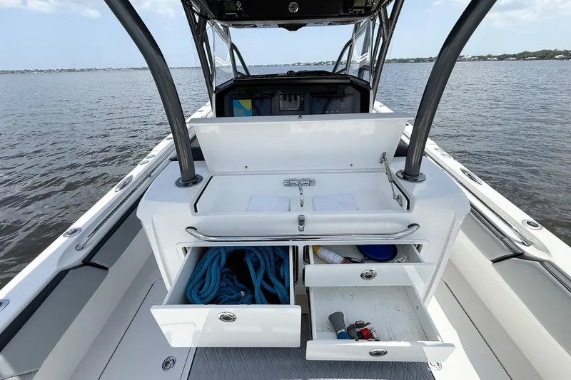 Slide: The Image of 2018 Nor-Tech 392 Super Fish boat with open storage drawers and ocean view. - 25