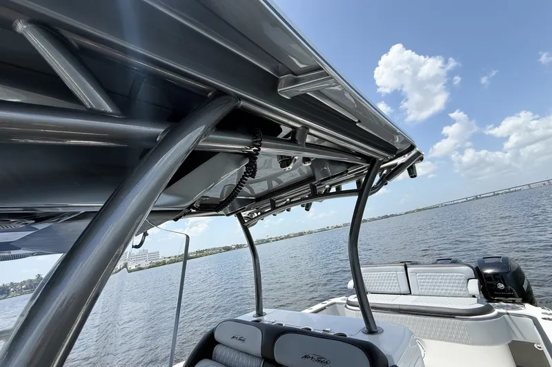 Slide: The Image of 2018 Nor-Tech 392 Super Fish boat on water, showcasing sleek design and sturdy framework. - 20
