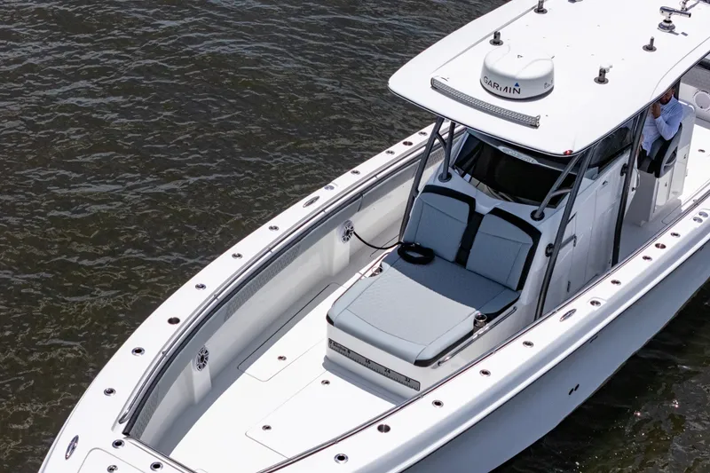 Slide: The Image of 2018 Nor-Tech 392 Super Fish boat on water, featuring sleek design and spacious deck. - 54