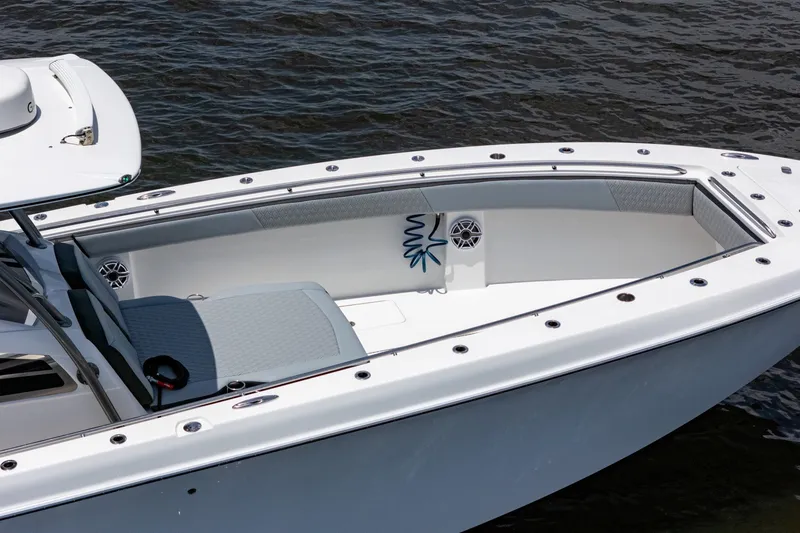 Slide: The Image of 2018 Nor-Tech 392 Super Fish boat, sleek design, spacious deck, on calm water. - 51