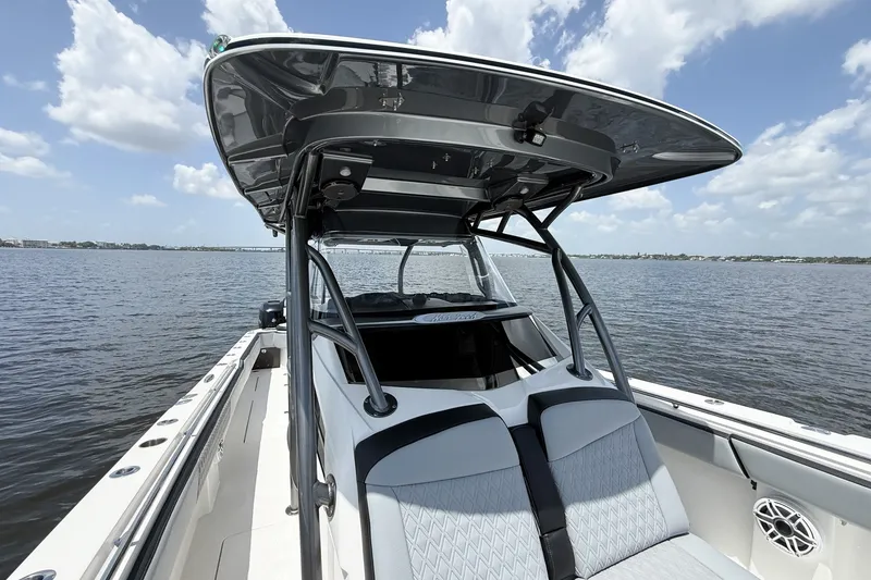 Slide: The Image of 2018 Nor-Tech 392 Super Fish boat on calm water under a partly cloudy sky. - 17