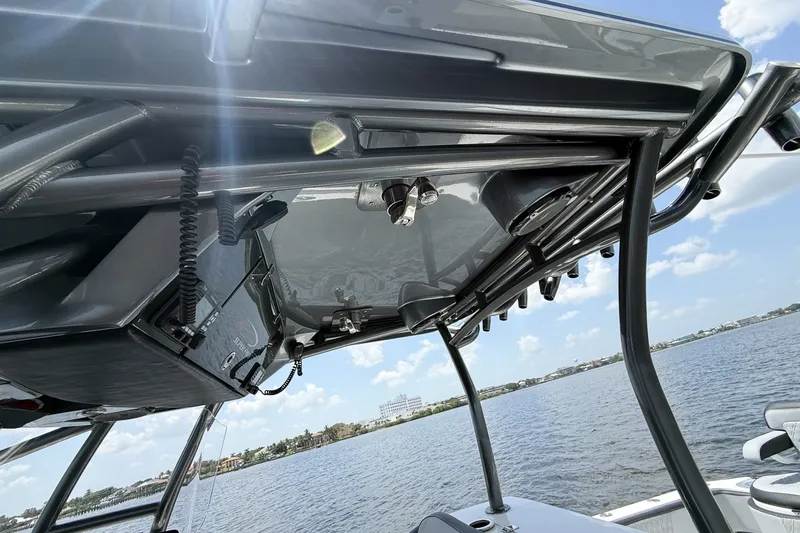 Slide: The Image of 2018 Nor-Tech 392 Super Fish boat with advanced electronics, viewed from the deck under a clear sky. - 21