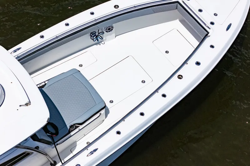 Slide: The Image of 2018 Nor-Tech 392 Super Fish boat deck, featuring spacious seating and storage compartments. - 2