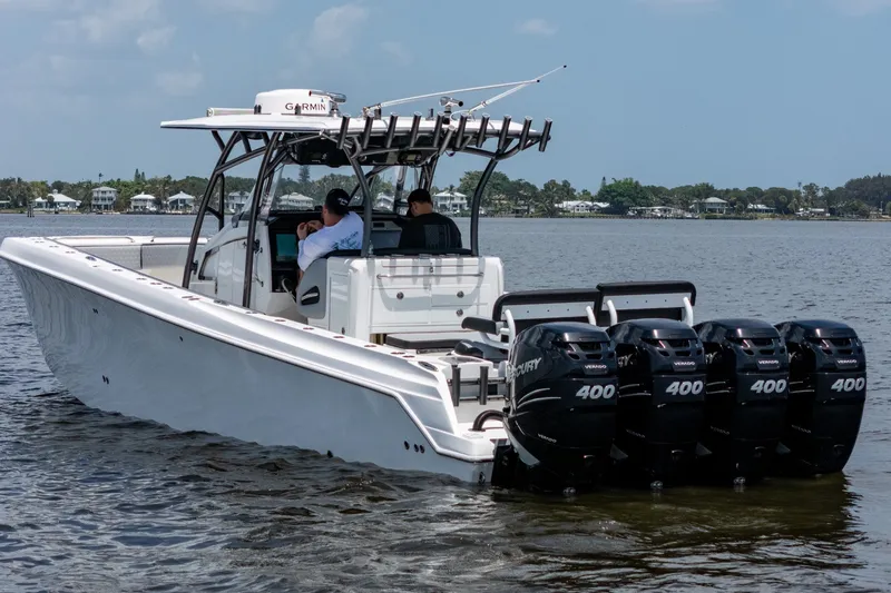 Slide: The Image of 2018 Nor-Tech 392 Super Fish boat with four Mercury 400 engines on calm water. - 48