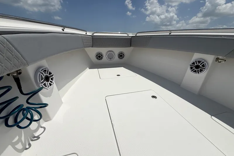Slide: The Image of 2018 Nor-Tech 392 Super Fish boat interior with speakers and storage compartments. - 14