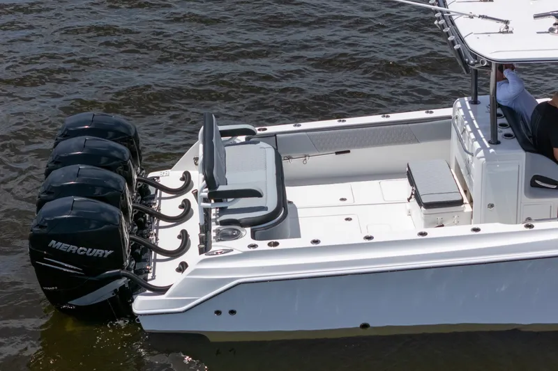 Slide: The Image of 2018 Nor-Tech 392 Super Fish boat with four Mercury engines on water. - 3