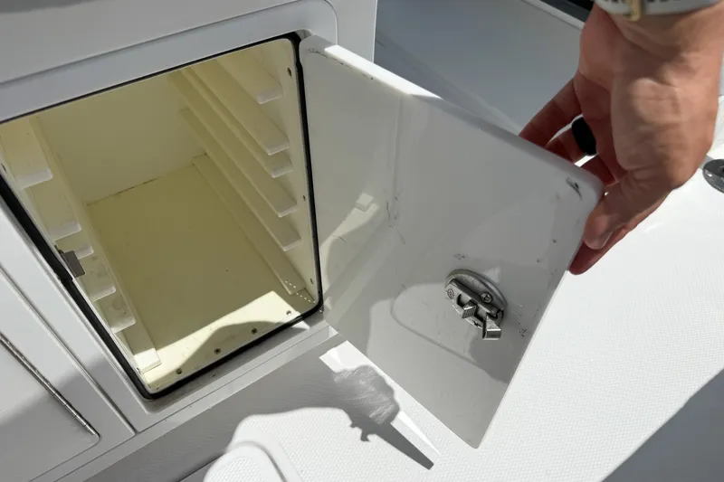 Slide: The Image of Open storage compartment on a 2018 Nor-Tech 392 Super Fish boat. - 28