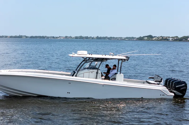 Slide: The Image of 2018 Nor-Tech 392 Super Fish boat cruising on open water. - 36